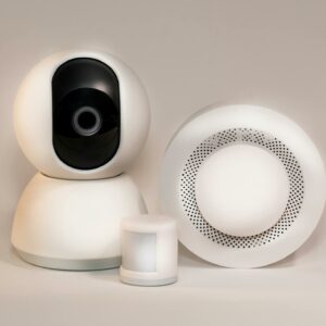 A collection of modern smart home security devices featuring cameras and sensors.